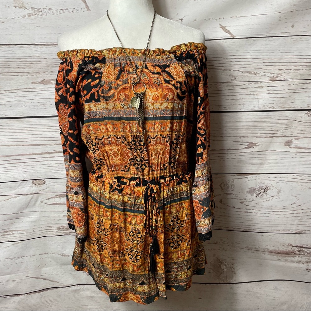 Angie black and orange off the shoulder romper. Size Medium.